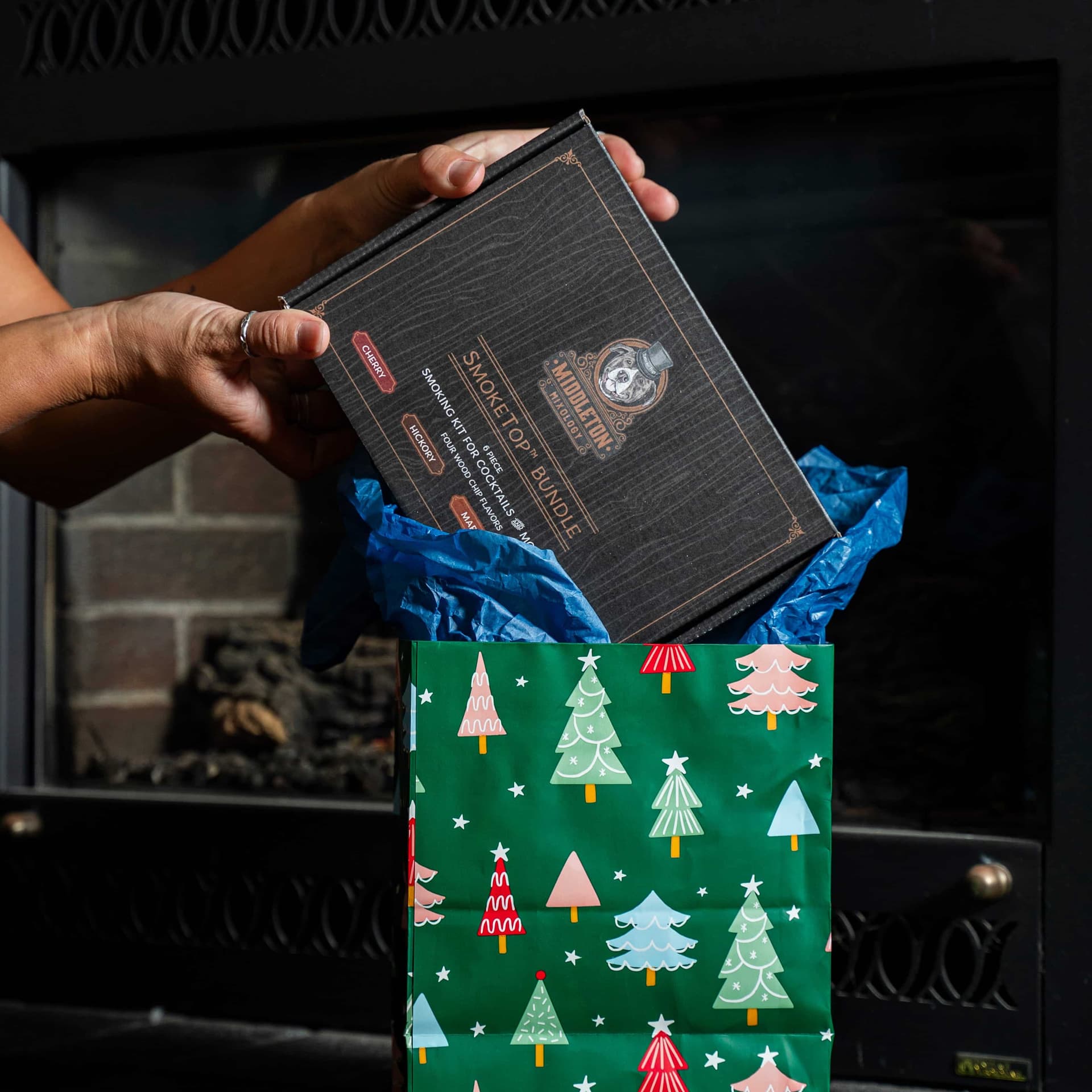 Unwrapping a SmokeTop cocktail smoker kit on Christmas morning
