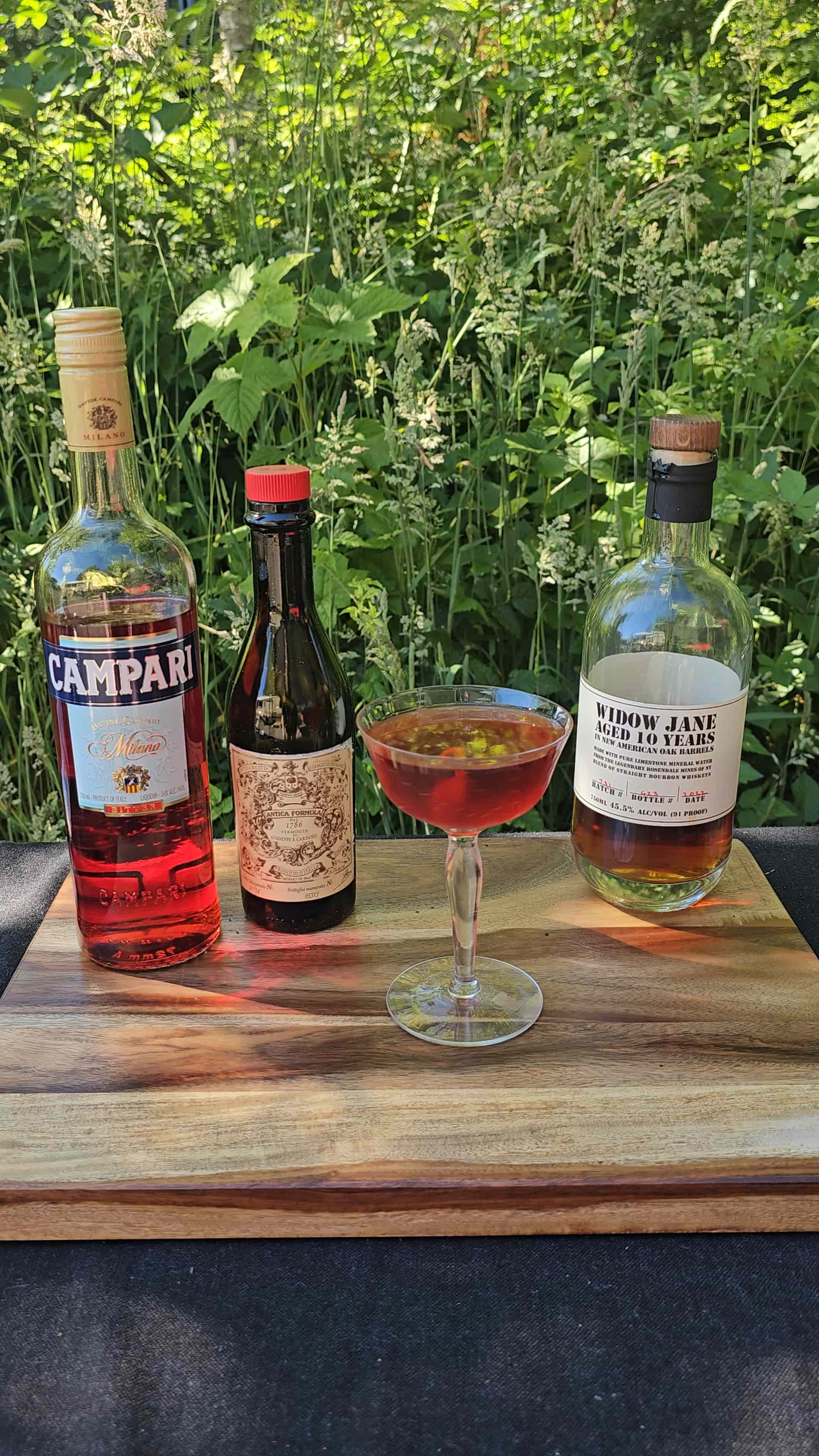 Smoked boulevardier in a crystal rocks glass with orange twist