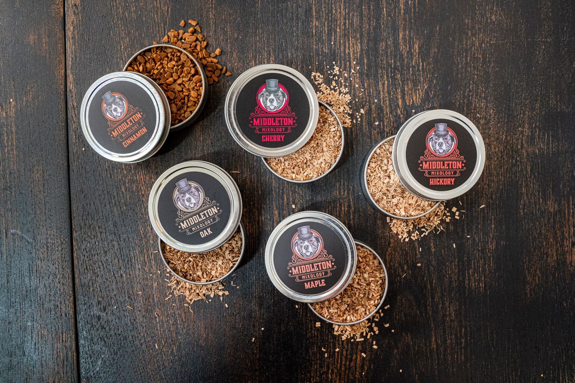 Collection of cocktail smoking wood chip tins in cherry, oak, hickory, and maple